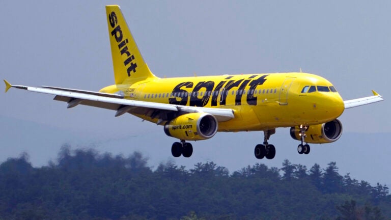 A Spirit Airlines 319 Airbus approaches Manchester Boston Regional Airport for a landing.