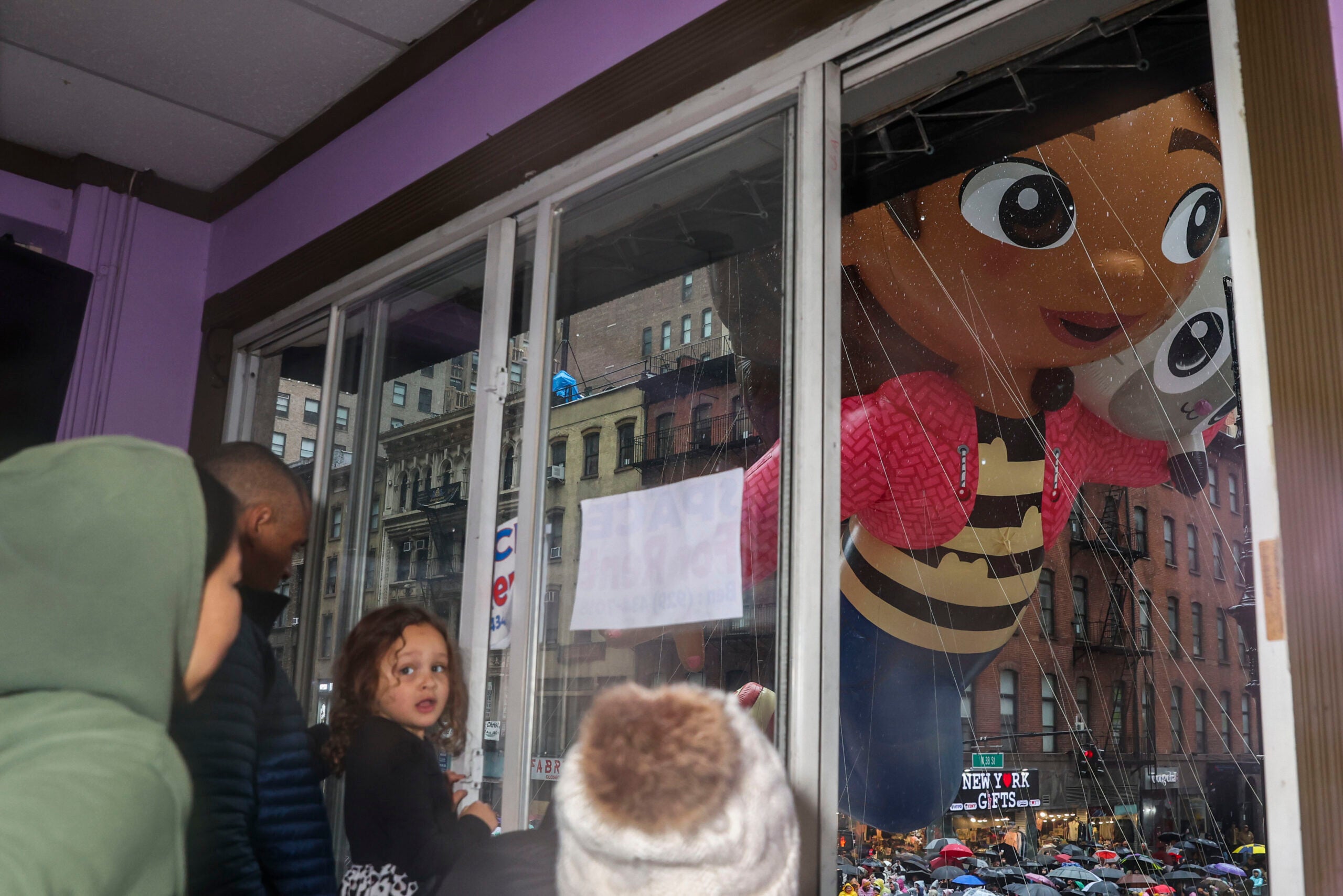 Quenton Lindstrom and his friends and family watch the Macy's Thanksgiving Day parade.