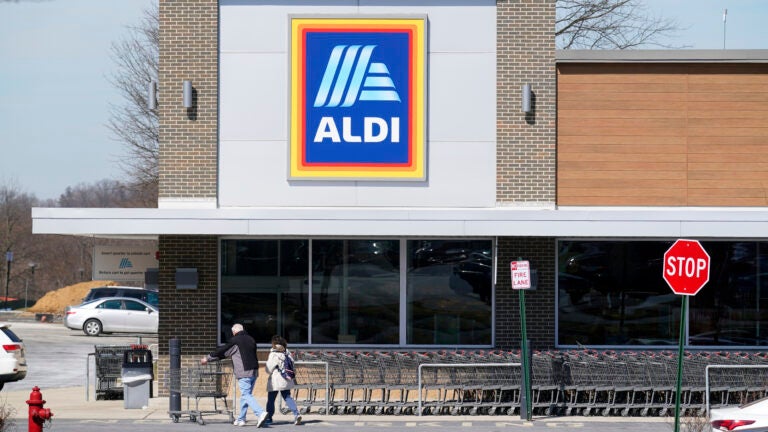 Customers walk into an Aldi supermarket.