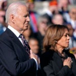 President Joe Biden, left, and Vice President Kamala Harris look on during a wreath laying ceremony at the Tomb of the Unknown Soldier on National Veterans Day Observance at Arlington National Cemetery in Arlington, Va., Monday, Nov. 11, 2024.