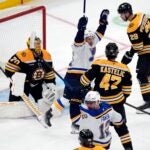 St. Louis Blues' Nathan Walker (26) celebrates a goal by Radek Faksa (12) past Boston Bruins' Joonas Korpisalo (70) during the first period of an NHL hockey game, Saturday, Nov. 16, 2024, in Boston.