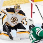 Boston Bruins goaltender Jeremy Swayman (1) defends the goal against Dallas Stars left wing Jason Robertson (21) during the first period of an an NHL hockey game Thursday, Nov. 14, 2024, in Dallas.