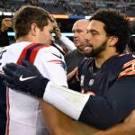 CHICAGO, ILLINOIS - NOVEMBER 10: Caleb Williams #18 of the Chicago Bears and Drake Maye #10 of the New England Patriots embrace after the game at Soldier Field on November 10, 2024 in Chicago, Illinois.