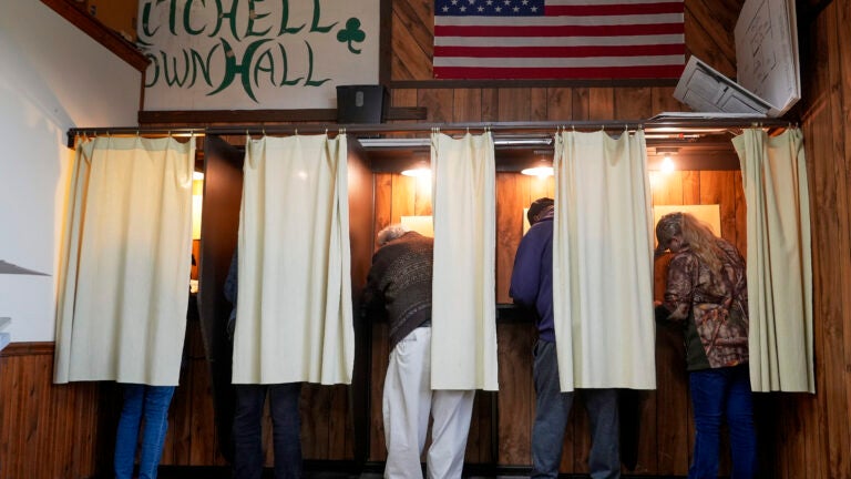 Voters mark their ballots at a polling place, Tuesday, Nov. 5, 2024, in Mitchell, Wis.
