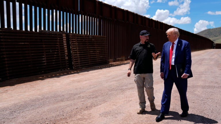 FILE - Republican presidential candidate former President Donald Trump listens to Paul Perez, president of the National Border Patrol Council, as he tours the southern border with Mexico in Sierra Vista, Arizona, Aug. 22, 2024.