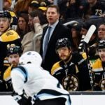 BOSTON, MA - NOVEMBER 21: Boston Bruins interim head coach Joe Sacco looks on behind the bench during the first period against the Utah Hockey Club at TD Garden on November 21, 2024 in Boston, Massachusetts