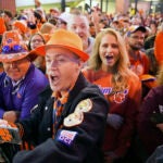 FILE - Clemson fans cheer on the Tigers as they arrive at Williams-Brice Stadium.