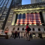 FILE - People pass the New York Stock Exchange on Nov. 5, 2024, in New York.