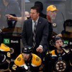 Boston Bruins’ Joe Sacco, now the interim head coach, on the bench in the first period at TD Garden.