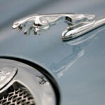 FILE - The hood ornament and a portion of the grill of a Jaguar automobile is shown at a dealership in Norwood, Mass. on March 26, 2008.