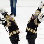 Boston Bruins' Jeremy Swayman, left, and Linus Ullmark celebrate the team's win over the Toronto Maple Leafs in Game 1 of an NHL hockey Stanley Cup first-round playoff series Saturday, April 20, 2024, in Boston.