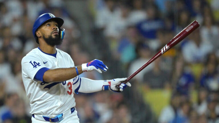 Los Angeles Dodgers' Teoscar Hernandez watches the flight of the ball that went foul during a baseball game against the Seattle Mariners, Tuesday, Aug. 20, 2024, in Los Angeles.