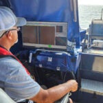 Keith Cormican, founder of Bruce's Legacy, a nonprofit organization that specializes in recovering drowning victims, searches the waters of Green Lake, Wis., during the search for missing kayaker Ryan Borgwardt in in September 2024.
