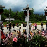 FILE - In this July 6, 2019, file photo, people view a memorial at the site where seven bikers riding with the Jarheads Motorcycle Club were killed in a collision in Randolph, N.H. Gasanov