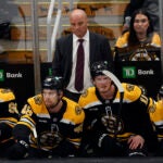 Boston Bruins head coach Jim Montgomery and the bench react to a second goal by the Columbus Blue Jackets in the first period at TD Garden.