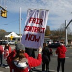 Members of the Beverly Teachers Association (BTA) rally for a new contract in front of Henry’s Market on Sunday.