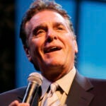 FILE - Chuck Woolery hosts a special premiere of the "$250,000 Game Show Spectacular" at the Las Vegas Hilton Saturday, Oct. 13, 2007, in Las Vegas.