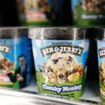 Pints of Ben & Jerry’s ice cream are seen on a shelf.