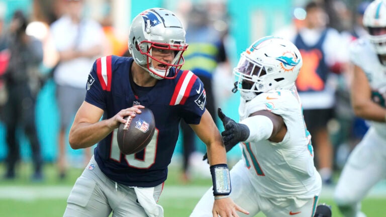 Miami Dolphins linebacker Emmanuel Ogbah (91) goes after New England Patriots quarterback Drake Maye (10) during the second half of an NFL football game, Sunday, Nov. 24, 2024, in Miami Gardens, Fla.