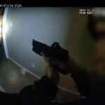 This police body camera image provided by Las Vegas Metropolitan Police shows police responding to a home invasion on Nov. 12, 2024 in Las Vegas.