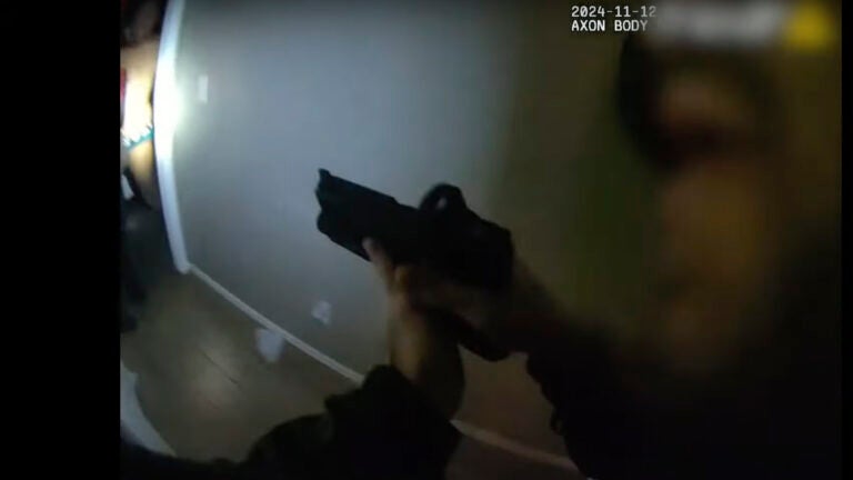 This police body camera image provided by Las Vegas Metropolitan Police shows police responding to a home invasion on Nov. 12, 2024 in Las Vegas.