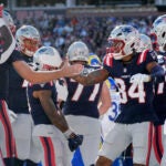 Kendrick Bourne is congratulated by quarterback Drake May after his touchdown against the Rams.