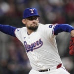 Texas Rangers starting pitcher Nathan Eovaldi throws to the Toronto Blue Jays in the first inning of a baseball game in Arlington, Texas, Tuesday, Sept. 17, 2024.