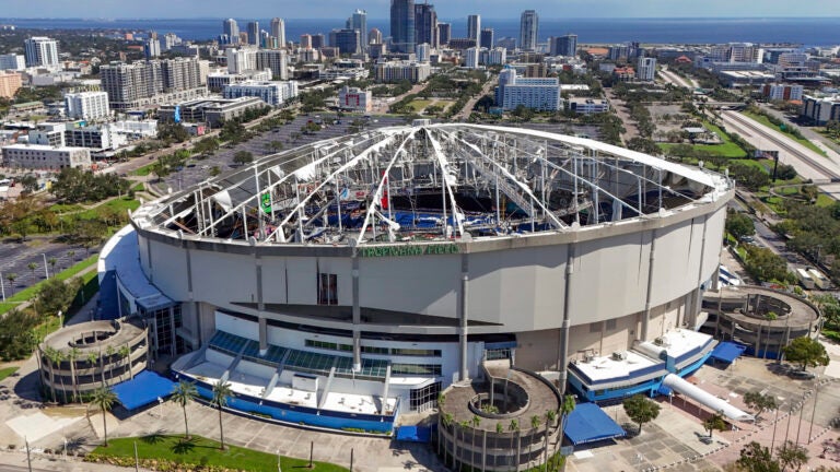 The roof of the Tropicana Field is damaged the morning after Hurricane Milton hit the region.