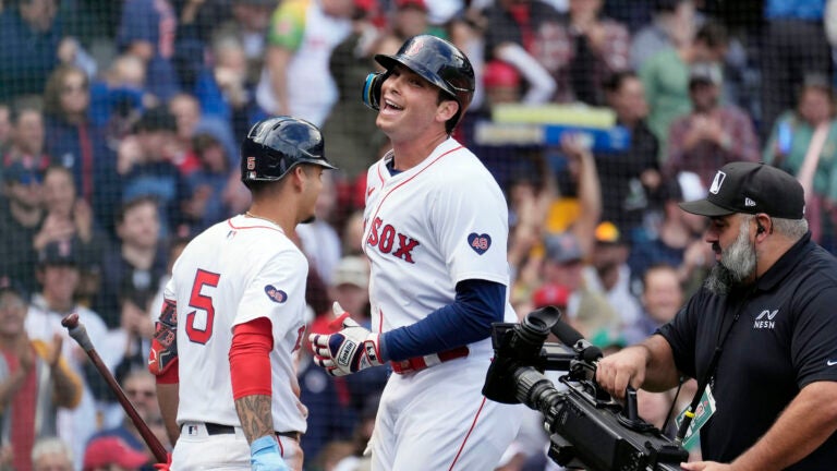 Boston Red Sox's Triston Casas, center, celebrates after his solo home run with Vaughn Grissom (5) during the fifth inning of the first game of a baseball doubleheader against the Minnesota Twins, Sunday, Sept. 22, 2024, in Boston.