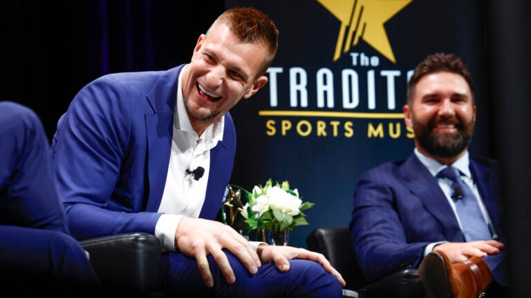 Former New England Patriot and Football Legacy Award honoree Rob Gronkowski and presenter Rob Ninkovich, also former Patriot and teammate of Gronkowski’s, laugh during “The Tradition,” the Sports Museum’s annual awards program, at TD Garden.