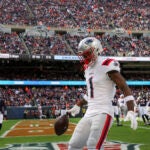 New England Patriots Ja’Lynn Polk celebrates his touchdown reception against the Chicago Bears during second quarter NFL action at Soldier Field