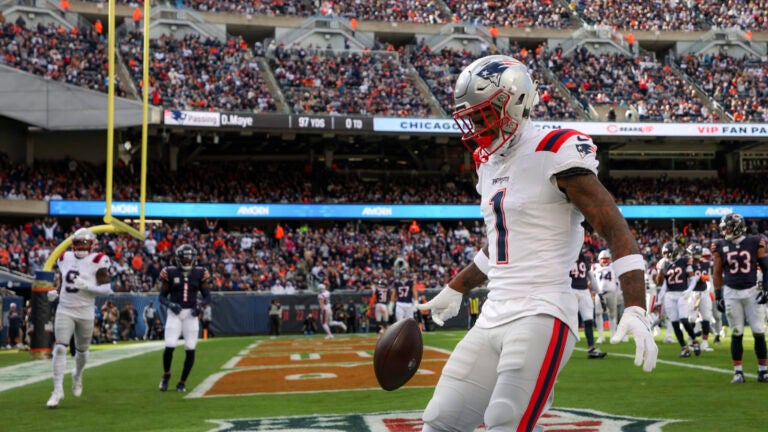 New England Patriots Ja’Lynn Polk celebrates his touchdown reception against the Chicago Bears during second quarter NFL action at Soldier Field