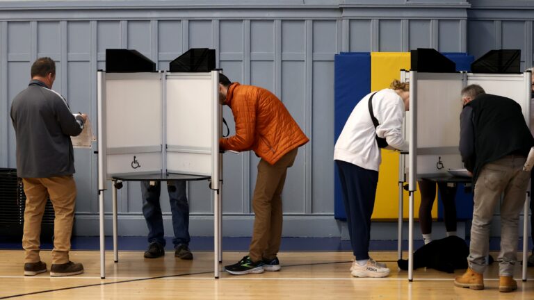 Voters with their ballot's voting in the Presidential Election at the Cristo Rey Boston High School, in Savin Hill on Election Day. After the Secretary of the Commonwealth announced an investigation into the City of Boston’s administration of the Nov. 5 election Wednesday, officials offered an explanation into the ballot shortages.