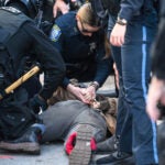 Police arrest a person in Kenmore Square at the Men’s March to Abolish Abortion and Rally for Personhood starting at Planned Parenthood on Commonwealth Avenue on Saturday.