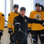 The Boston Bruins held practice at Warrior Ice Arena under their new coach, Joe Sacco after Jim Montgomery was fired as the head coach. Sacco instructs the players in a drill.