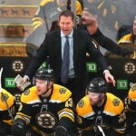 Bruins Coach Joe Sacco instructs his players in the 1st period.