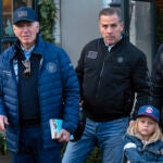 President Joe Biden accompanied by his son Hunter Biden and his grandson Beau.