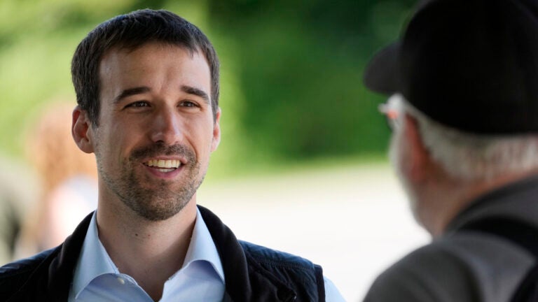 State Rep. Austin Theriault, R-Fort Kent, speaks with a voter.