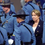 Massachusetts Gov. Maura Healey, right, walks among members of the 90th Recruit Training Group of the Massachusetts State Police.