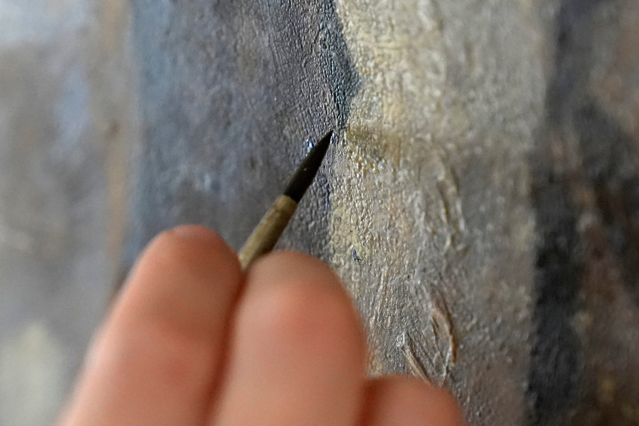 Conservator Corrine Long, of Dover, N.H., restores nearly 300-year-old painted angels.