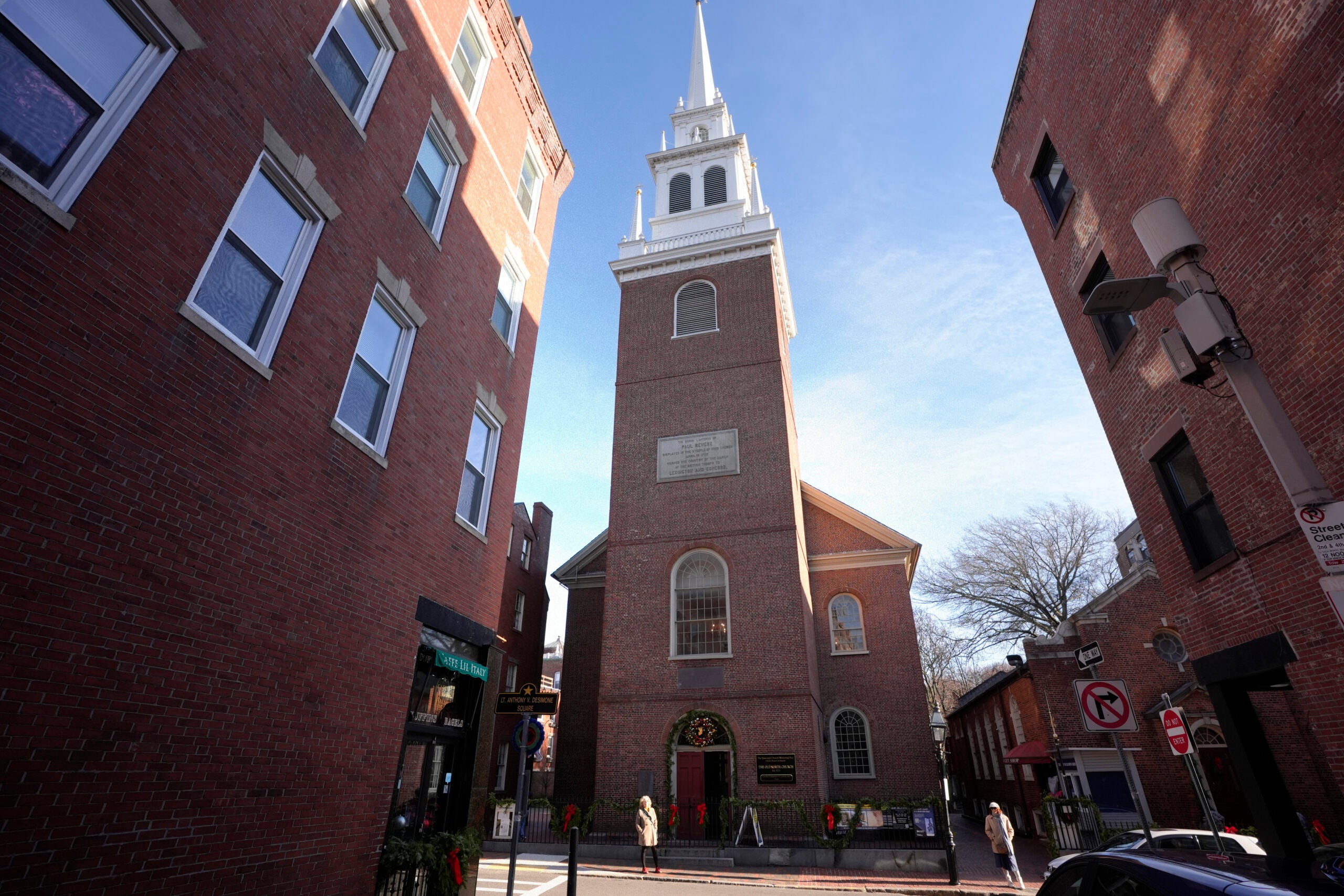 Passers-by walk near Old North Church.