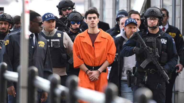 Luigi Mangione is escorted by police in New York.