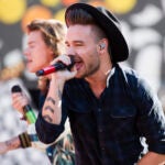 One Direction members, from right, Liam Payne and Harry Styles perform on ABC's "Good Morning America" at Rumsey Playfield/SummerStage in New York.