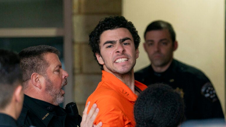 Suspect Luigi Mangione is taken into the Blair County Courthouse on Tuesday, Dec. 10, 2024, in Hollidaysburg, Pa.