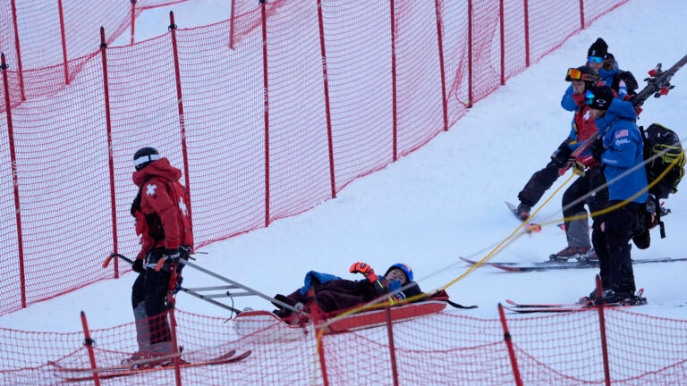 Mikaela Shiffrin is taken down the mountain on a sled by ski patrol after crashing during the second run of a women's World Cup giant slalom skiing race, Saturday, Nov. 30, 2024, in Killington, Vt.
