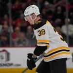 Morgan Geekie skates to the bench after scoring on the Blackhawks.