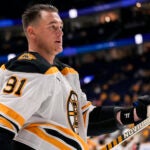 Boston Bruins defenseman Nikita Zadorov (91) warms up for the team's NHL hockey game against the Nashville Predators, Tuesday, Oct. 22, 2024, in Nashville, Tenn.