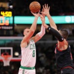 Kristaps Porzingis shoots a 3-pointer during a game against the Bulls.