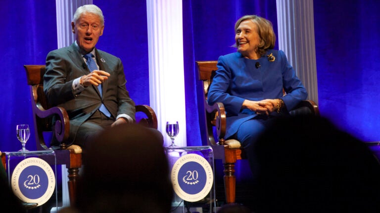 Former President Bill Clinton and former Secretary of State Hillary Rodham Clinton respond to audience questions on Saturday, Dec. 7, 2024 at the Robinson Center auditorium in Little Rock, Ark.