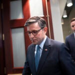 Speaker of the House Mike Johnson, R-La., arrives for a closed-door strategy session with fellow Republicans as they work on a final version of a spending bill before federal agencies run out of money at midnight on Friday night, at the Capitol in Washington, Tuesday, Dec. 17, 2024.